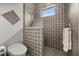 Sleek walk-in shower with designer tile, glass partition, and modern fixtures, creating a luxurious space at 6031 Dora Dr, Mount Dora, FL 32757