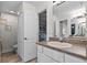 The bathroom features a single sink with a white vanity, linen closet and an entrance into a bedroom at 6136 Lake Emma Rd, Groveland, FL 34736
