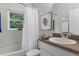 Bathroom showcasing tub, toilet, and sink with decoratives and natural lighting at 6136 Lake Emma Rd, Groveland, FL 34736