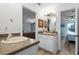 The bathroom features a single sink with a white vanity and entrance into multiple rooms at 6136 Lake Emma Rd, Groveland, FL 34736