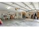 Spacious garage with ample storage, workspace, and room for a home gym setup and recreational equipment at 6136 Lake Emma Rd, Groveland, FL 34736