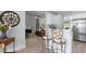 Open kitchen view with bar seating showing connection to the living room and stainless appliances at 6136 Lake Emma Rd, Groveland, FL 34736