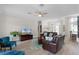 Spacious living room with hardwood floors, a ceiling fan, and an open layout at 6136 Lake Emma Rd, Groveland, FL 34736