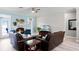 Comfortable living room features a fireplace and access to a deck at 6136 Lake Emma Rd, Groveland, FL 34736
