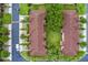 Aerial view of condo building with well-manicured lawns and sidewalks, as well as mature landscaping at 624 Terra Lago St, Davenport, FL 33897