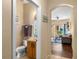 Bathroom featuring wood vanity, single sink, and view to living area at 624 Terra Lago St, Davenport, FL 33897