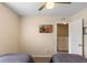 Cozy bedroom includes a ceiling fan and wall-mounted TV at 624 Terra Lago St, Davenport, FL 33897