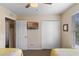 Bedroom with two twin beds, flat screen tv, ceiling fan, and closet at 624 Terra Lago St, Davenport, FL 33897