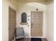 Close up of a cozy townhome entrance, featuring a secure door and convenient seating at 624 Terra Lago St, Davenport, FL 33897