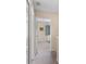 Upstairs hallway with neutral carpet and a view into a bedroom at 624 Terra Lago St, Davenport, FL 33897