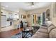 Cozy living room and kitchen area with modern furnishings and a sliding glass door at 624 Terra Lago St, Davenport, FL 33897