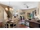 Open concept living room and kitchen with hardwood floors and natural light at 624 Terra Lago St, Davenport, FL 33897
