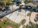 Aerial view of a beach volleyball court, patio and nearby parking at the community center at 624 Terra Lago St, Davenport, FL 33897