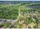 Expansive aerial view of a wooded property featuring lush greenery and mature trees at 6731 Lake Griffin Rd, Lady Lake, FL 32159
