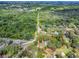 An aerial view showcases property lines of a home surrounded by verdant trees and foliage at 6731 Lake Griffin Rd, Lady Lake, FL 32159