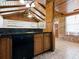 Kitchen view with wood cabinets and brick adjacent room at 6731 Lake Griffin Rd, Lady Lake, FL 32159