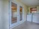 The area features a washer, dryer, and double doors leading to an outdoor area at 6731 Lake Griffin Rd, Lady Lake, FL 32159