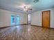 View of the living room with double doors to the outside at 6731 Lake Griffin Rd, Lady Lake, FL 32159