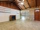 Charming living room boasts wood ceilings, tile floors, a modern fireplace, and brick accents for a unique touch at 6731 Lake Griffin Rd, Lady Lake, FL 32159