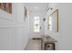 Bright entryway with a modern console table and decorative wall accents at 709 Longboat Dr, Davenport, FL 33896