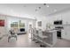 Open kitchen with a center island, white cabinets, and stainless steel appliances at 709 Longboat Dr, Davenport, FL 33896