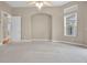 Bedroom featuring plush carpet, neutral walls, and natural light at 7303 Spring Mountain Ln, Yalaha, FL 34797