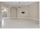 Expansive living space with tile floors and fan, pre-wired for media at 7303 Spring Mountain Ln, Yalaha, FL 34797