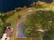 Aerial view of the home with waterfront access and large private yard at 81 N Carol Ave, Mascotte, FL 34753