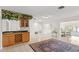 Entertaining space with custom bar, wine rack, and convenient access to living and dining areas at 81 N Carol Ave, Mascotte, FL 34753