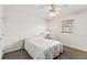This bedroom features carpet flooring, a window, and a ceiling fan with a light fixture at 81 N Carol Ave, Mascotte, FL 34753