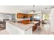 Bright eat-in kitchen with granite countertops, wooden cabinetry, and stainless steel appliances at 81 N Carol Ave, Mascotte, FL 34753