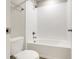 Bright bathroom featuring white subway tile shower and tub combo at 853 Blue Creek Dr, Haines City, FL 33844