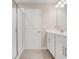 Bathroom featuring a glass enclosed shower, modern vanity and neutral color palette at 853 Blue Creek Dr, Haines City, FL 33844