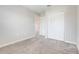 Bedroom featuring plush carpet and an closet, providing a peaceful and comfortable space at 853 Blue Creek Dr, Haines City, FL 33844