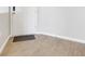 Clean entryway featuring neutral walls, light-colored tile flooring, and a white door at 853 Blue Creek Dr, Haines City, FL 33844