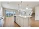 Spacious kitchen with quartz island, stainless steel appliances, and tile flooring at 853 Blue Creek Dr, Haines City, FL 33844