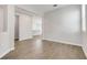 Open-concept living room with tile flooring, neutral walls, and seamless flow to the kitchen at 853 Blue Creek Dr, Haines City, FL 33844