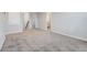 Upstairs loft area with soft carpeting and neutral walls offers a versatile living space at 853 Blue Creek Dr, Haines City, FL 33844