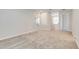 Neutral upstairs loft area with soft carpeting and neutral walls offers a versatile living space at 853 Blue Creek Dr, Haines City, FL 33844
