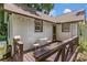 Inviting backyard deck with outdoor seating, ideal for enjoying the peaceful surroundings at 9233 Silver Lake Dr, Leesburg, FL 34788