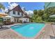 Inviting backyard pool area, ideal for relaxing and entertaining with ample patio space at 9233 Silver Lake Dr, Leesburg, FL 34788