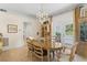 Formal dining room with french doors that open to the pool area at 9233 Silver Lake Dr, Leesburg, FL 34788