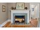 Charming fireplace with a decorative mantel, tiled accents, and a cozy bench seating at 9233 Silver Lake Dr, Leesburg, FL 34788