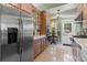 Spacious kitchen with stainless steel appliances, breakfast nook, and tile flooring at 9233 Silver Lake Dr, Leesburg, FL 34788