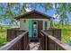 Picturesque lake house with a welcoming walkway, providing a serene lakeside retreat at 9233 Silver Lake Dr, Leesburg, FL 34788