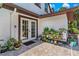 A charming patio featuring potted plants and a cozy seating area, perfect for relaxing at 9233 Silver Lake Dr, Leesburg, FL 34788