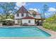 Large pool with a brick surround, offering backyard views and access to the home at 9233 Silver Lake Dr, Leesburg, FL 34788