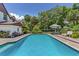 Backyard pool and seating area, perfect for relaxation and outdoor entertaining at 9233 Silver Lake Dr, Leesburg, FL 34788