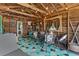 Cozy sunroom showcasing a geometric rug, wood-paneled walls, beamed vaulted ceiling, and comfortable seating arrangements at 9233 Silver Lake Dr, Leesburg, FL 34788