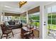 Bright sunroom with ample windows and comfortable seating for relaxing at 9233 Silver Lake Dr, Leesburg, FL 34788